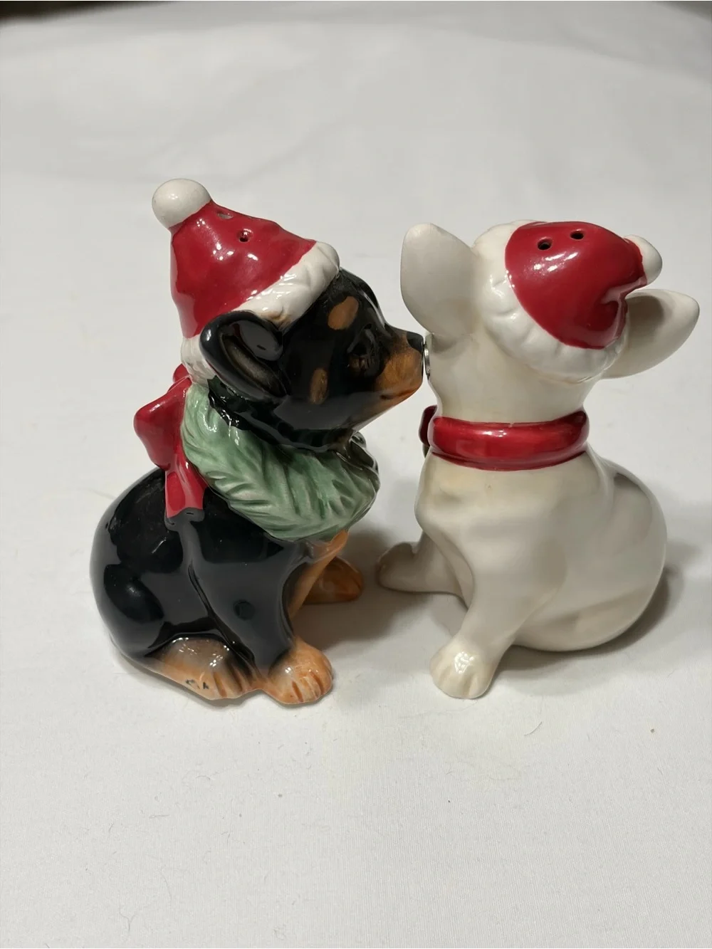 Chi Chi  Ceramic Salt and Pepper Shakers. Magnetic kissing.